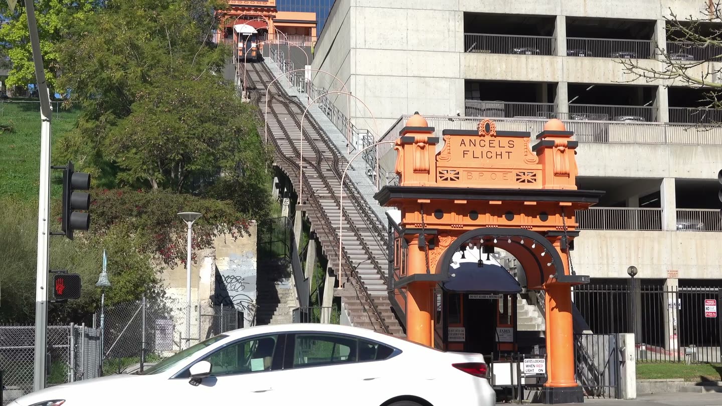 The orange Angels Flight station arch at the bottom of the hill on Hill Street