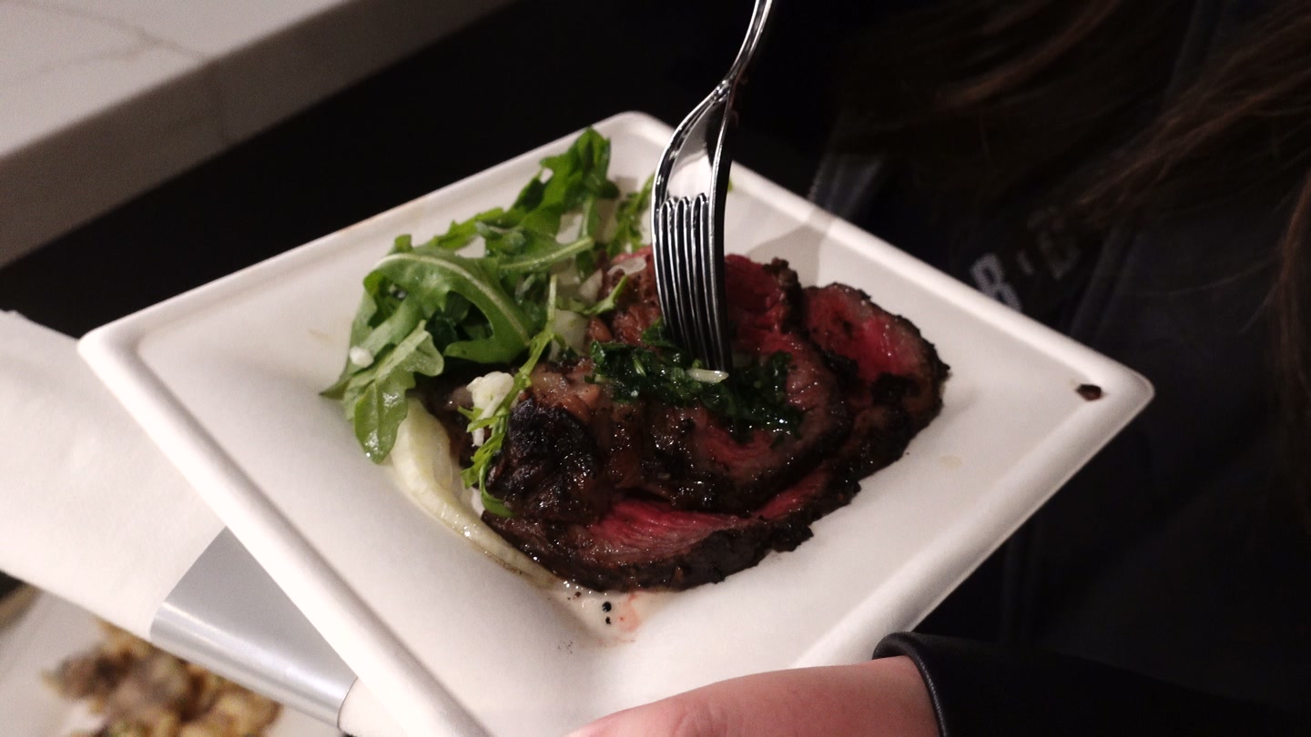 Close-up of our prime rib plate with greens in the North Red Lounge at Intuit Dome