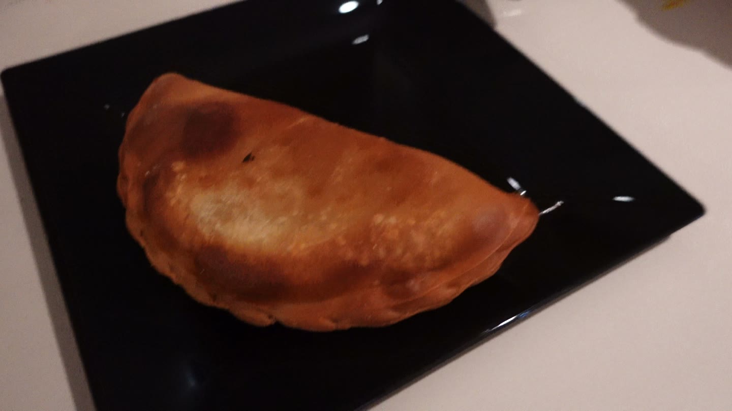 The pizza empanada we tried at halftime in the Founders Club.