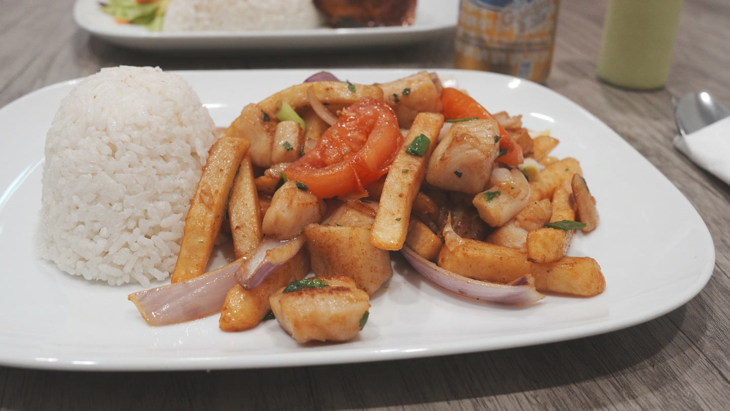 Fish saltado with fries and rice from The Inka Spot.