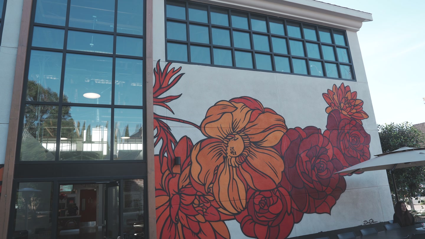 Colorful floral artwork on the Rodeo72 building.