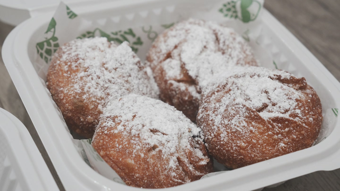 Powdered-sugar-dusted ube beignets from Shootz.