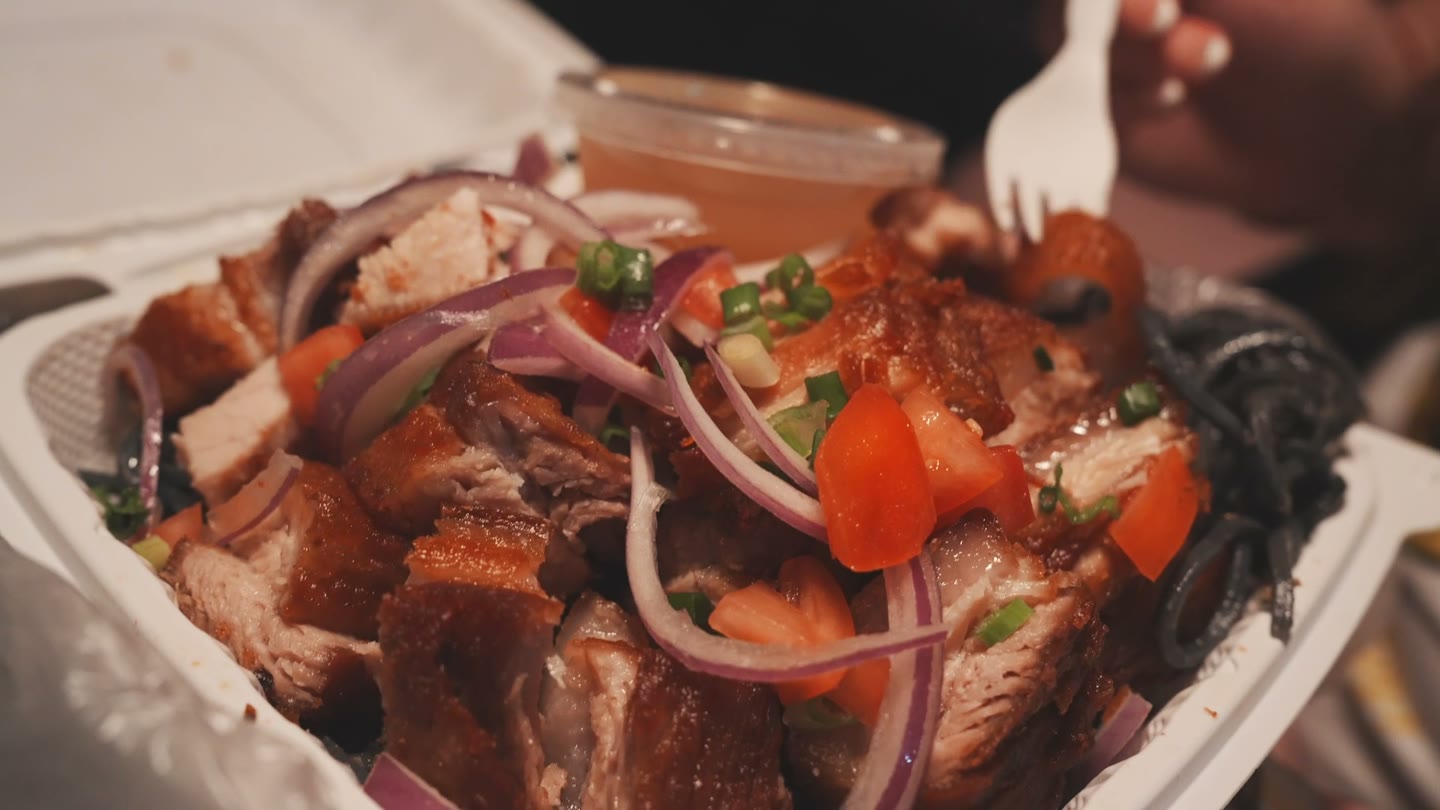 Ube pasta with garlic sauce and crispy lechon from Adela's Country Eatery.
