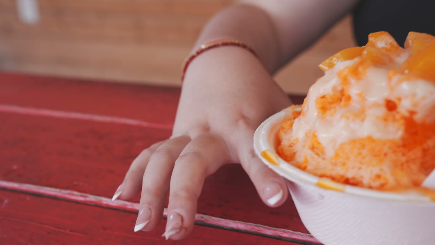 Peach shave ice at Rainbow House in Kahuku.